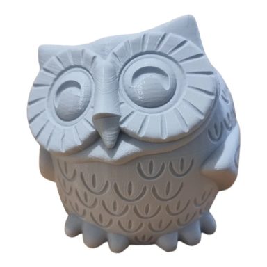 Chouette en céramique blanche, au design stylisé et souriant.