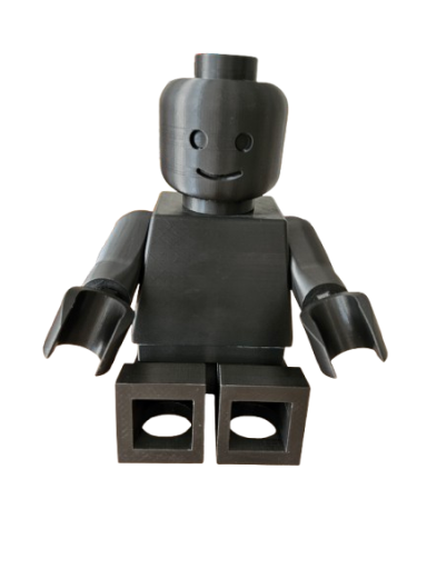 Figurine en plastique noir représentant un bonhomme LEGO avec un sourire.